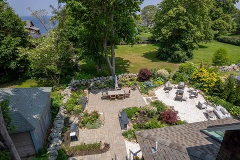 an aerial view of residential house with outdoor space and lake view