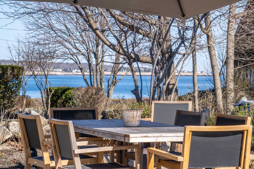 19 Old Garden Road Rockport, MA 01966 - Photo 42 of 42 a view of a chairs and table in the backyard