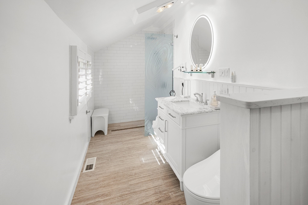 19 Old Garden Road Rockport, MA 01966 - Photo 7 of 42 a bathroom with a sink a toilet and a mirror