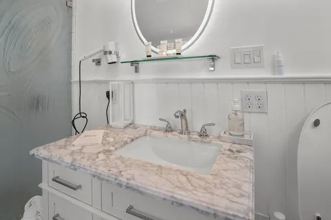 a bathroom with a sink and a mirror