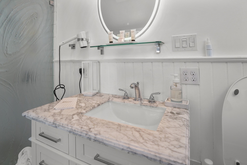 19 Old Garden Road Rockport, MA 01966 - Photo 9 of 42 a bathroom with a sink and a mirror