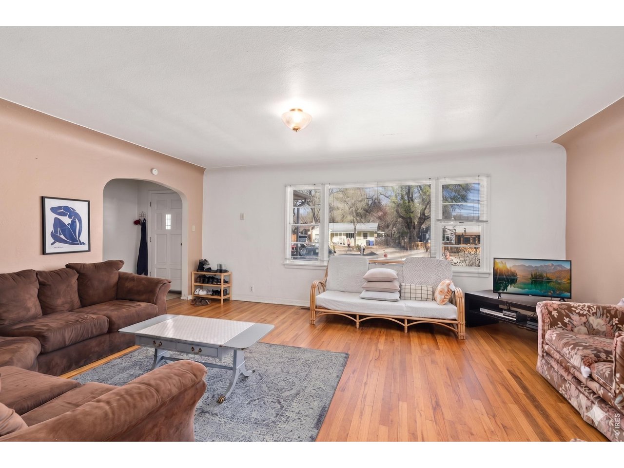 821 West Mulberry Street Fort Collins, CO 80521 - Photo 3 of 13 a living room with furniture and a wooden floor
