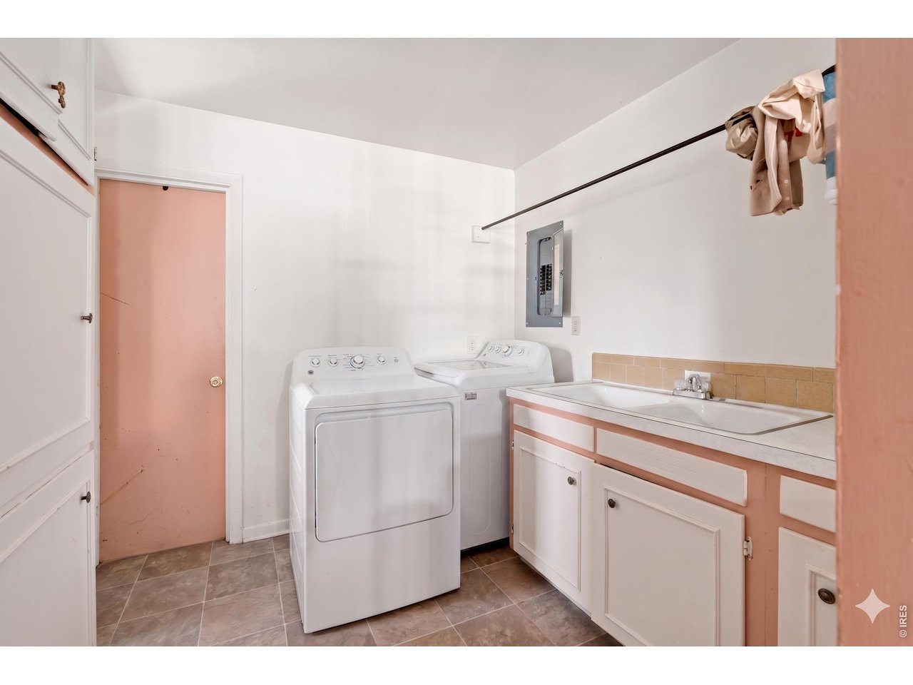821 West Mulberry Street Fort Collins, CO 80521 - Photo 8 of 13 a utility room with cabinets washer and dryer