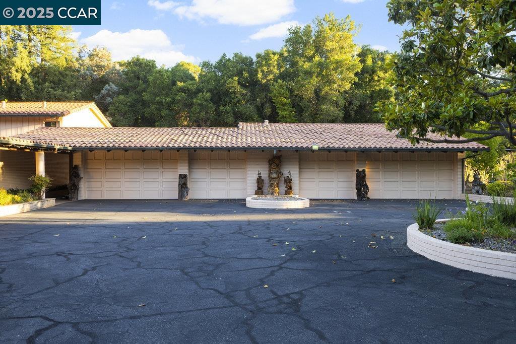 940 Reliez Station Lane Lafayette, CA 94549 - Photo 42 of 53 a view of a house with a yard and garage