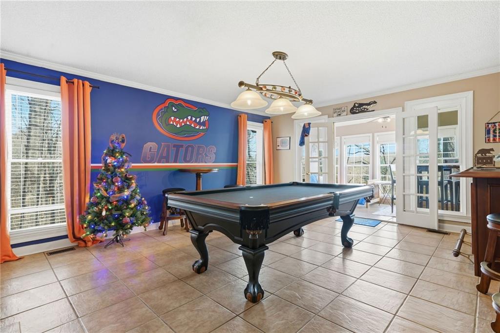 1008 River Estates Road Cleveland, GA 30528 - Photo 18 of 37 a room with pool table table and sofas