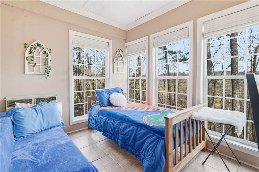 1008 River Estates Road Cleveland, GA 30528 - Photo 19 of 37 a bedroom with furniture and a window