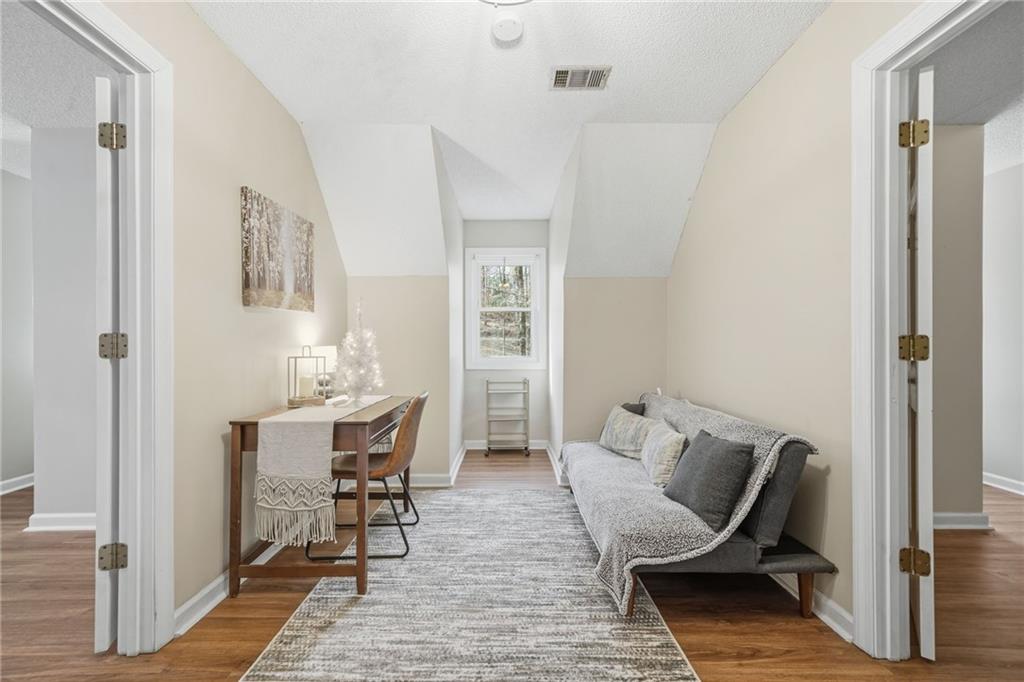 1008 River Estates Road Cleveland, GA 30528 - Photo 24 of 37 a view of a dining room with furniture and wooden floor