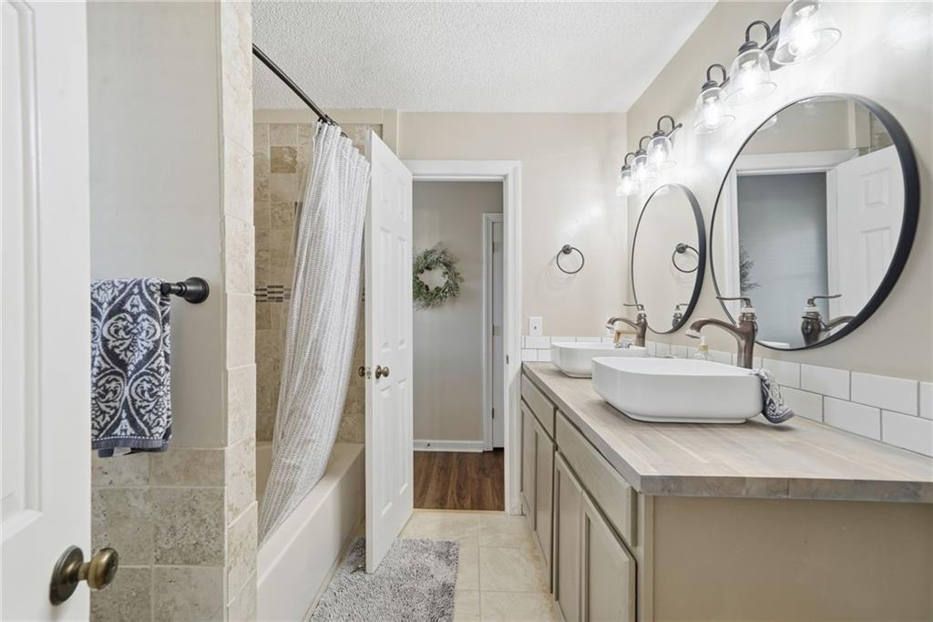 1008 River Estates Road Cleveland, GA 30528 - Photo 27 of 37 a bathroom with a sink and a mirror