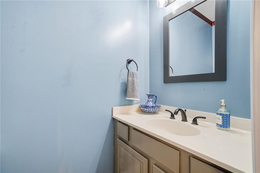 1008 River Estates Road Cleveland, GA 30528 - Photo 31 of 37 a bathroom with a sink and a mirror