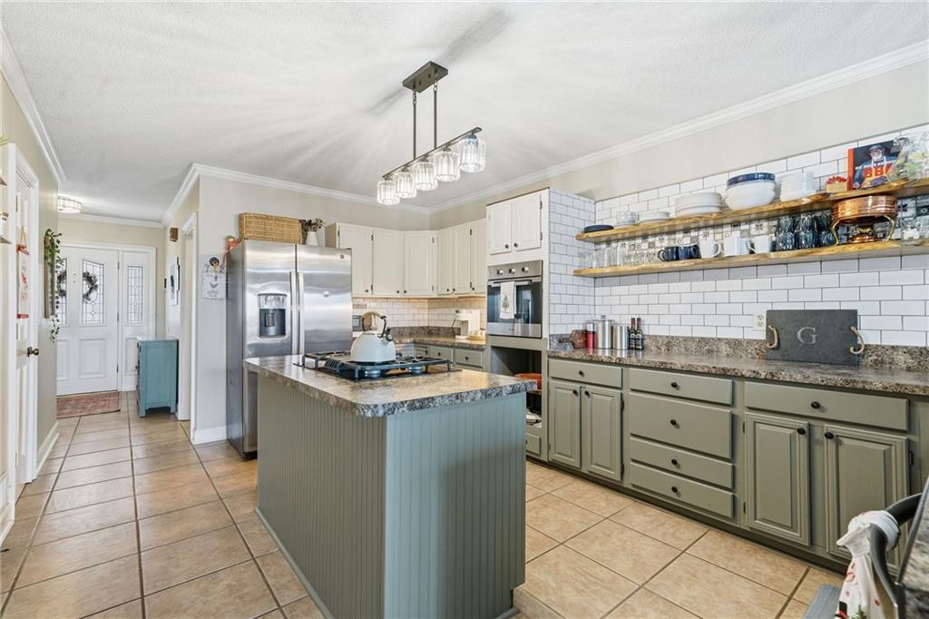 1008 River Estates Road Cleveland, GA 30528 - Photo 8 of 37 a kitchen with stainless steel appliances granite countertop a sink and stove