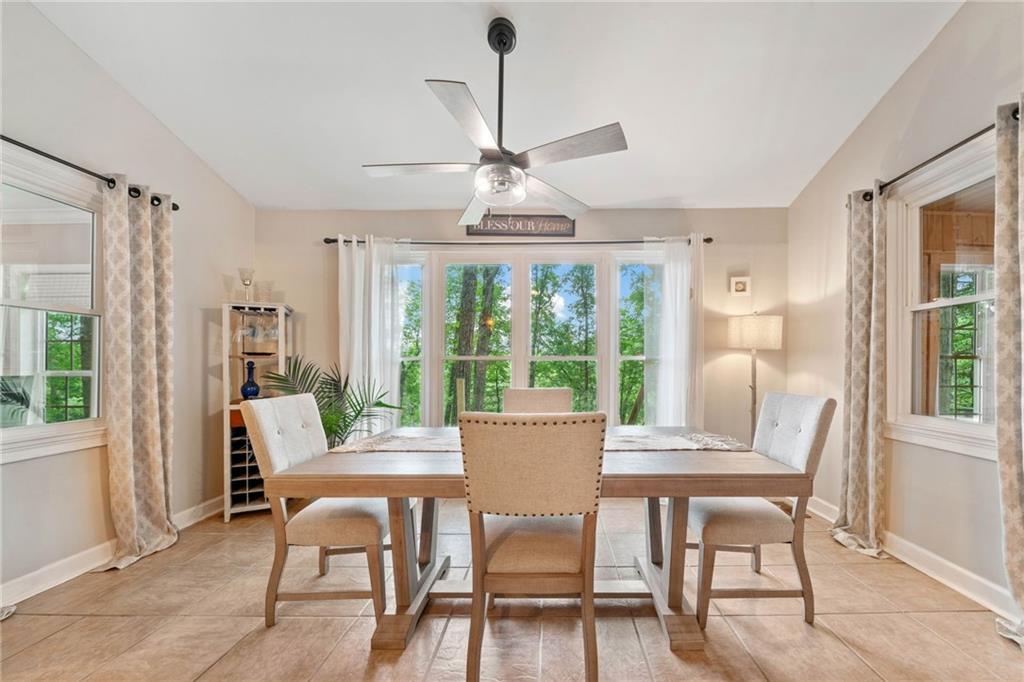 1008 River Estates Road Cleveland, GA 30528 - Photo 9 of 37 a dining room with furniture a chandelier and wooden floor