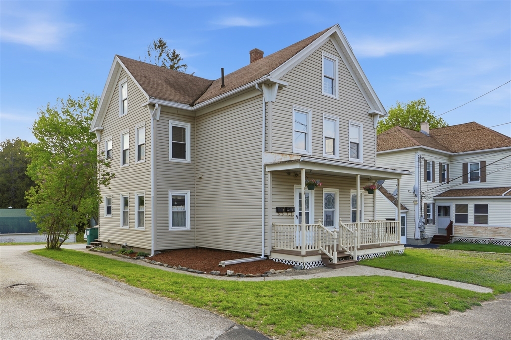 12 Whitcomb Street Webster, MA 01570 - Photo 1 of 40 a front view of a house with a yard and trees