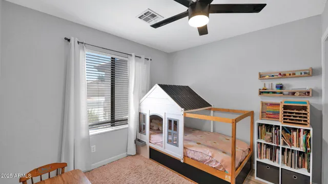 a bedroom with furniture and a window