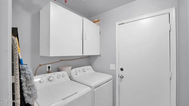 a kitchen with stainless steel appliances a kitchen island a stove a table and chairs