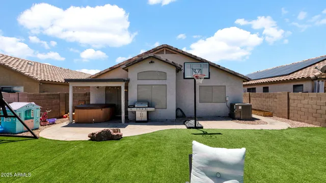 a view of a backyard with furniture