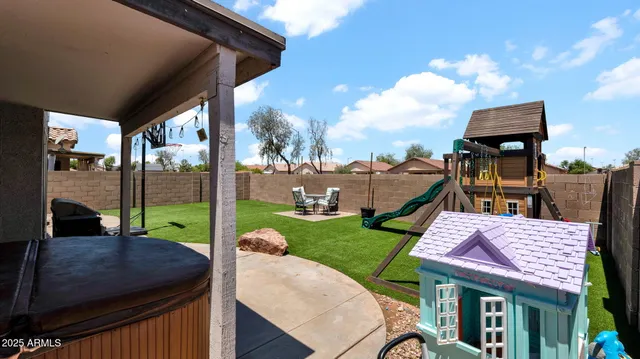 a view of a patio with table and chairs potted plants with wooden floor