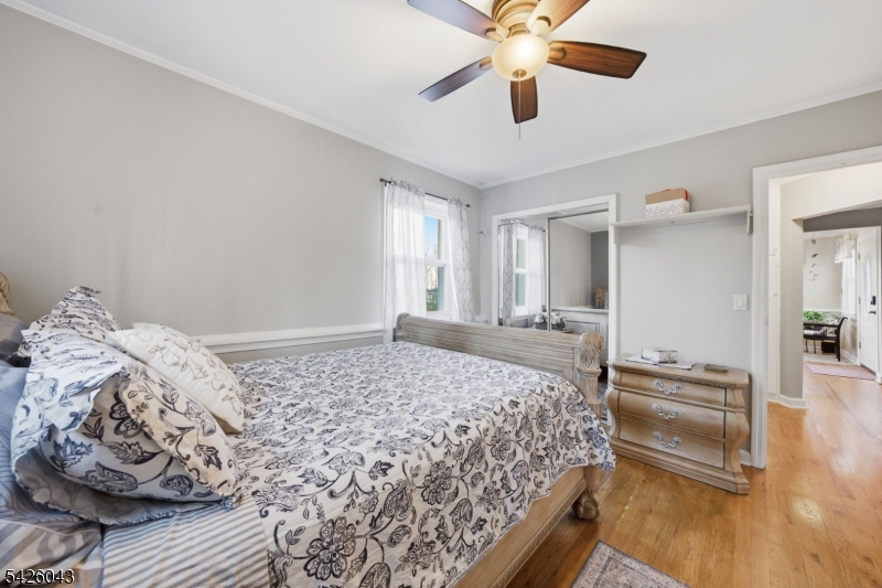 7 Valley Road Randolph, NJ 07869 - Photo 16 of 47 a bedroom with a large bed and a chandelier