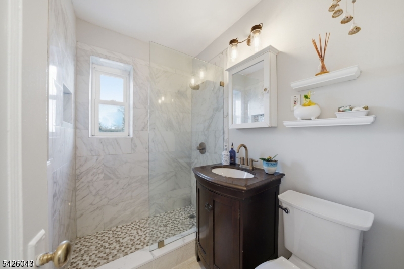 7 Valley Road Randolph, NJ 07869 - Photo 17 of 47 a bathroom with a sink a toilet and shower