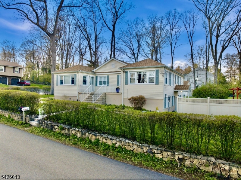 7 Valley Road Randolph, NJ 07869 - Photo 2 of 47 a front view of a house with a garden