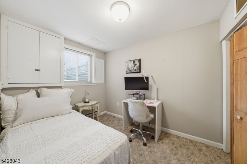 7 Valley Road Randolph, NJ 07869 - Photo 21 of 47 a bedroom with a bed desk and a window