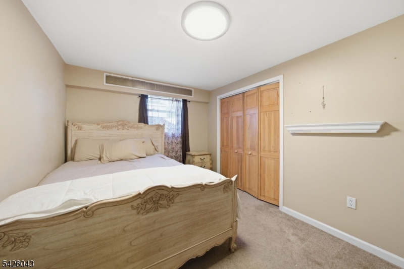 7 Valley Road Randolph, NJ 07869 - Photo 24 of 47 a bedroom with a bed and cabinets