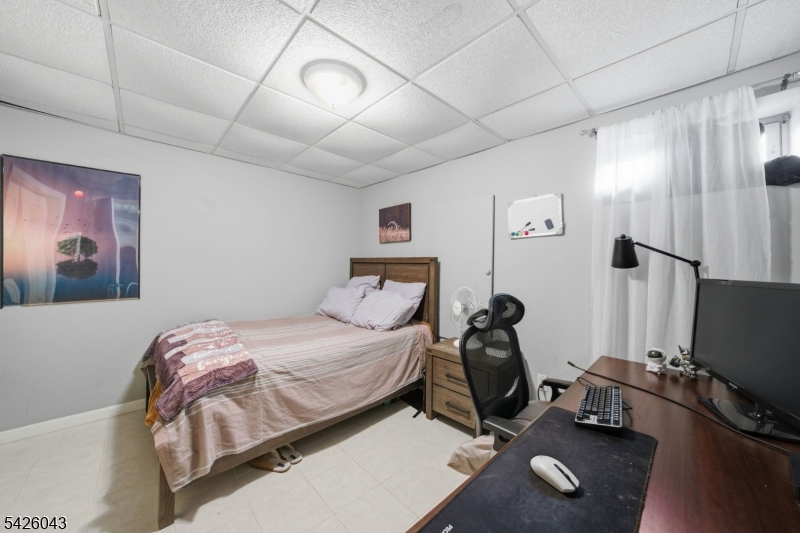 7 Valley Road Randolph, NJ 07869 - Photo 25 of 47 a bedroom with a bed and a flat screen tv