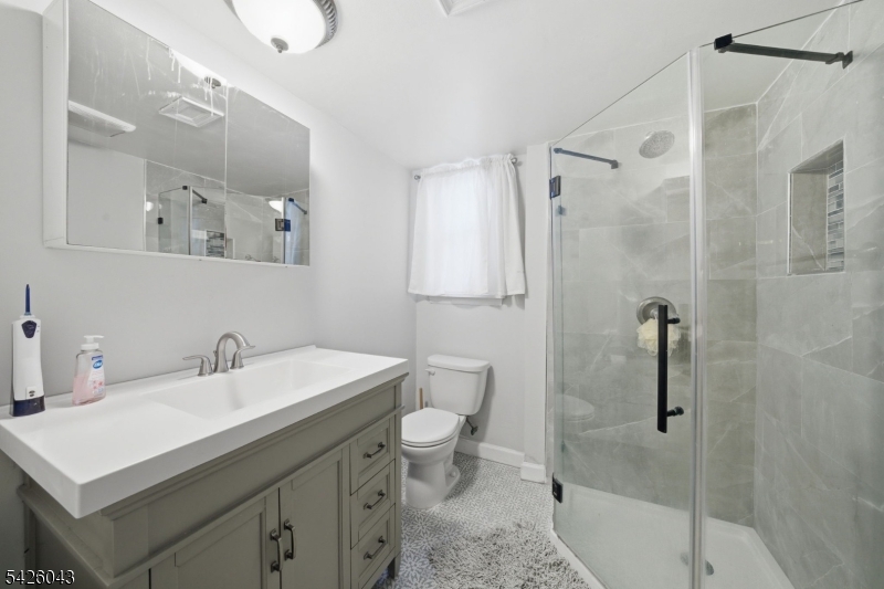 7 Valley Road Randolph, NJ 07869 - Photo 29 of 47 a bathroom with a sink toilet and shower