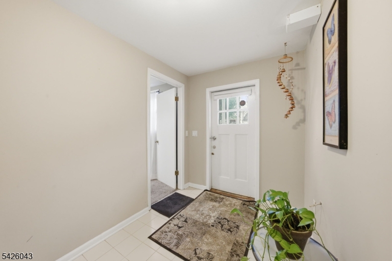 7 Valley Road Randolph, NJ 07869 - Photo 30 of 47 a living room with a rug and a potted plant