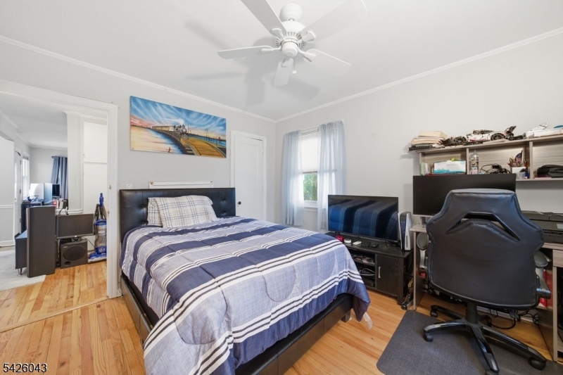 7 Valley Road Randolph, NJ 07869 - Photo 36 of 47 a bedroom with a bed and a chandelier