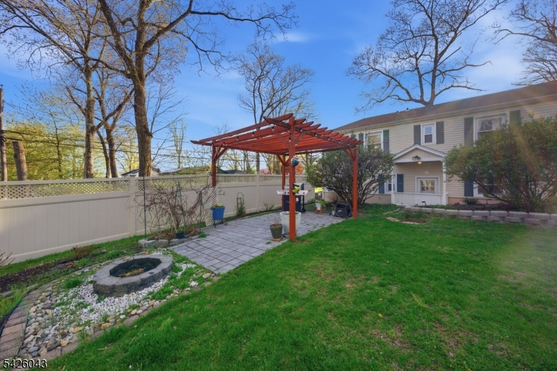 7 Valley Road Randolph, NJ 07869 - Photo 43 of 47 a view of a patio with a table chairs and a yard
