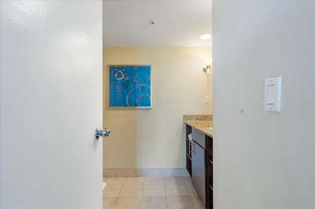 a bathroom with a sink and a washer dryer