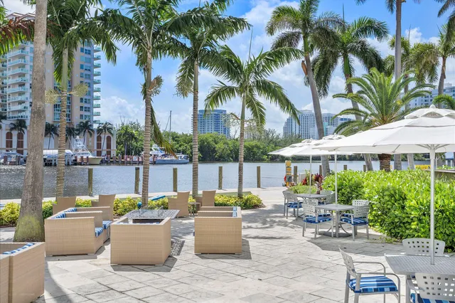 a view of a swimming pool with outdoor seating