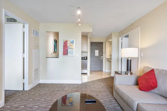 a living room with furniture and a rug