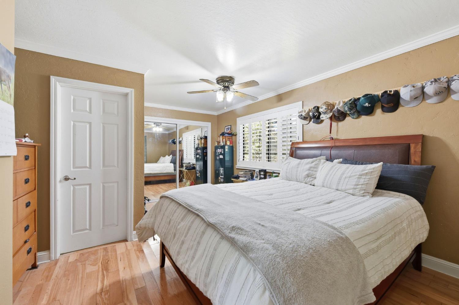 2440 Pleasant Valley Road Placerville, CA 95667 - Photo 25 of 40 bedroom featuring light wood finished floors, crown molding, a closet, and ceiling fan