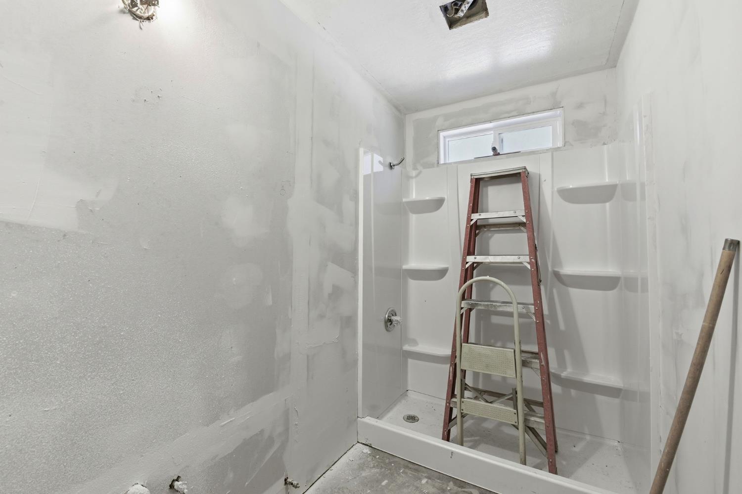 2440 Pleasant Valley Road Placerville, CA 95667 - Photo 27 of 40 bathroom featuring a stall shower and concrete floors