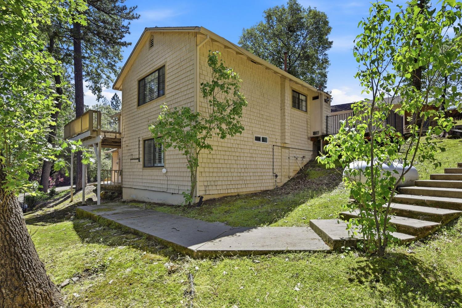 2440 Pleasant Valley Road Placerville, CA 95667 - Photo 36 of 40 view of side of property featuring a balcony and a lawn