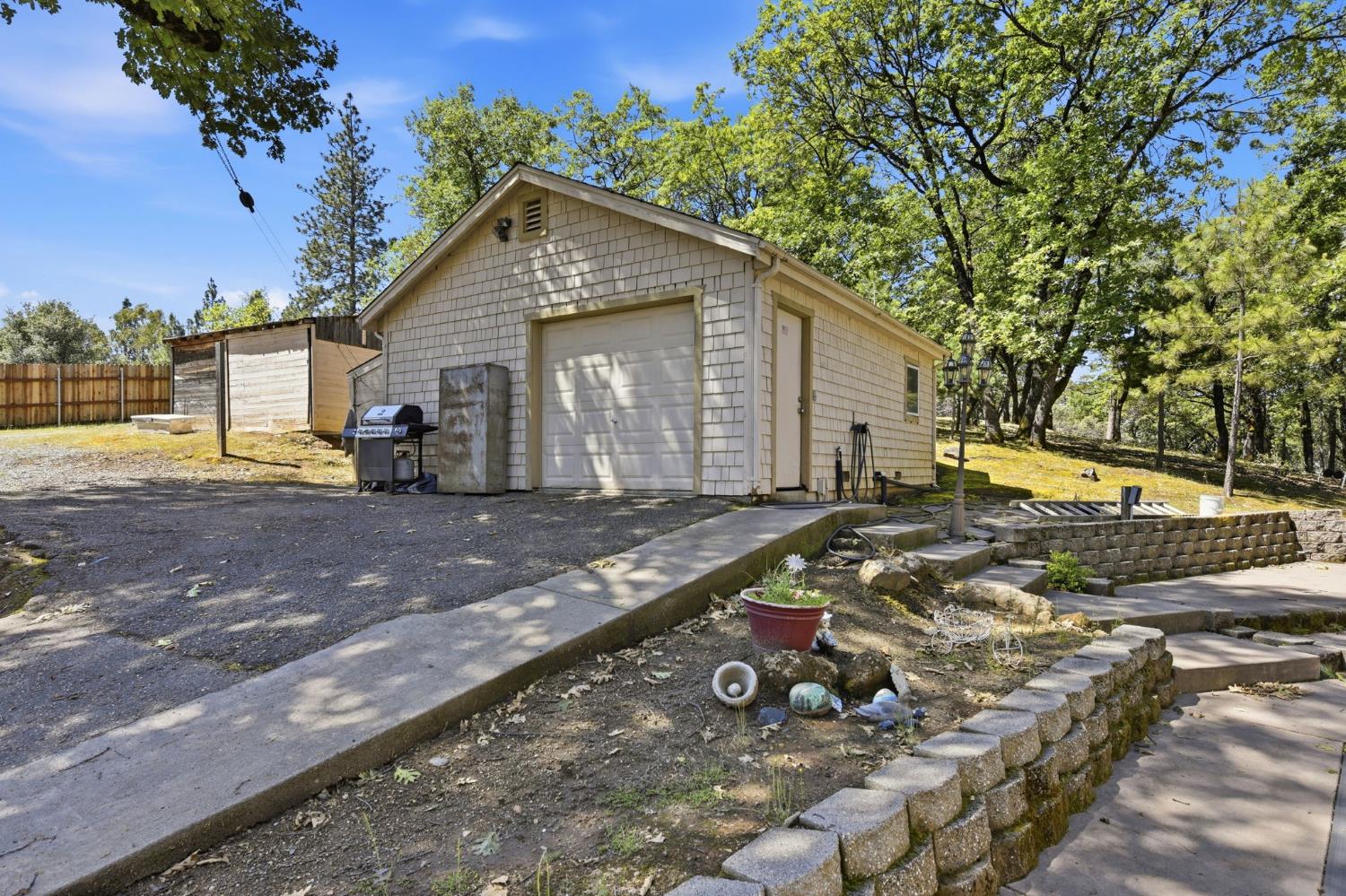 2440 Pleasant Valley Road Placerville, CA 95667 - Photo 39 of 40 view of home's exterior featuring a garage, driveway, and an outbuilding