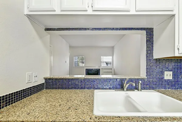 a bathroom with a bathtub and a sink