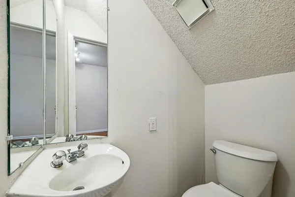 a bathroom with a sink and a toilet