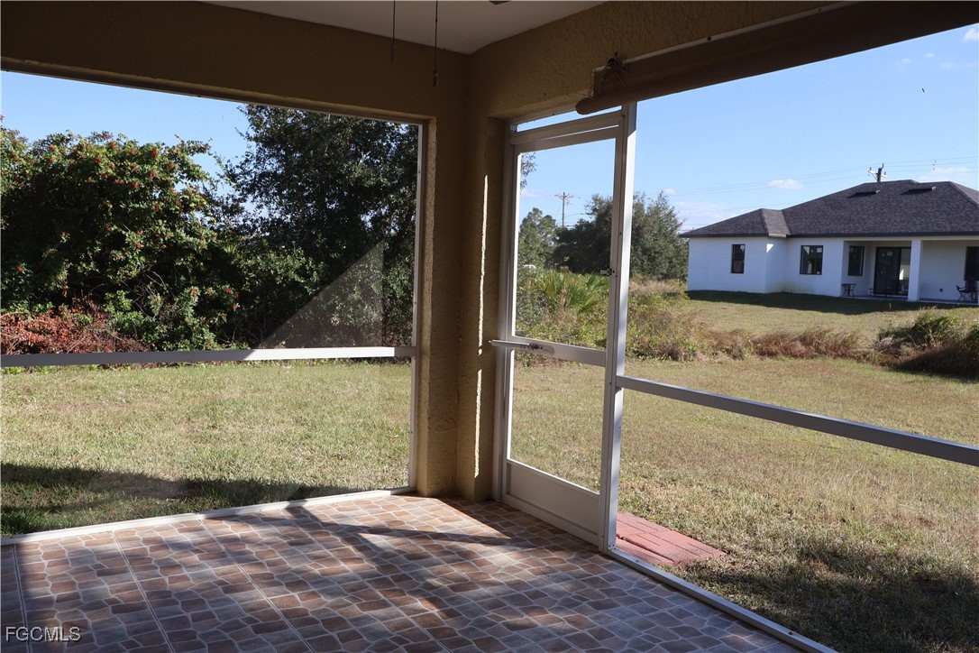 3805 22nd Street Southwest Lehigh Acres, FL 33976 - Photo 24 of 26 a view of a house with a backyard