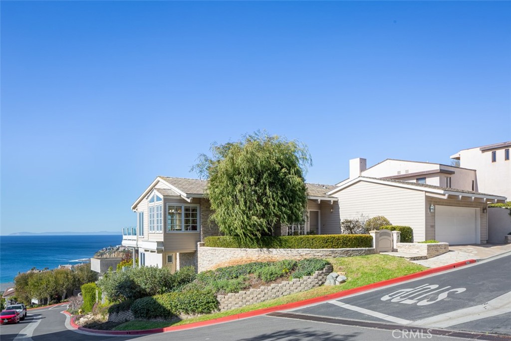521 Emerald Bay Laguna Beach, CA 92651 - Photo 1 of 42 a view of a house with a yard and plants