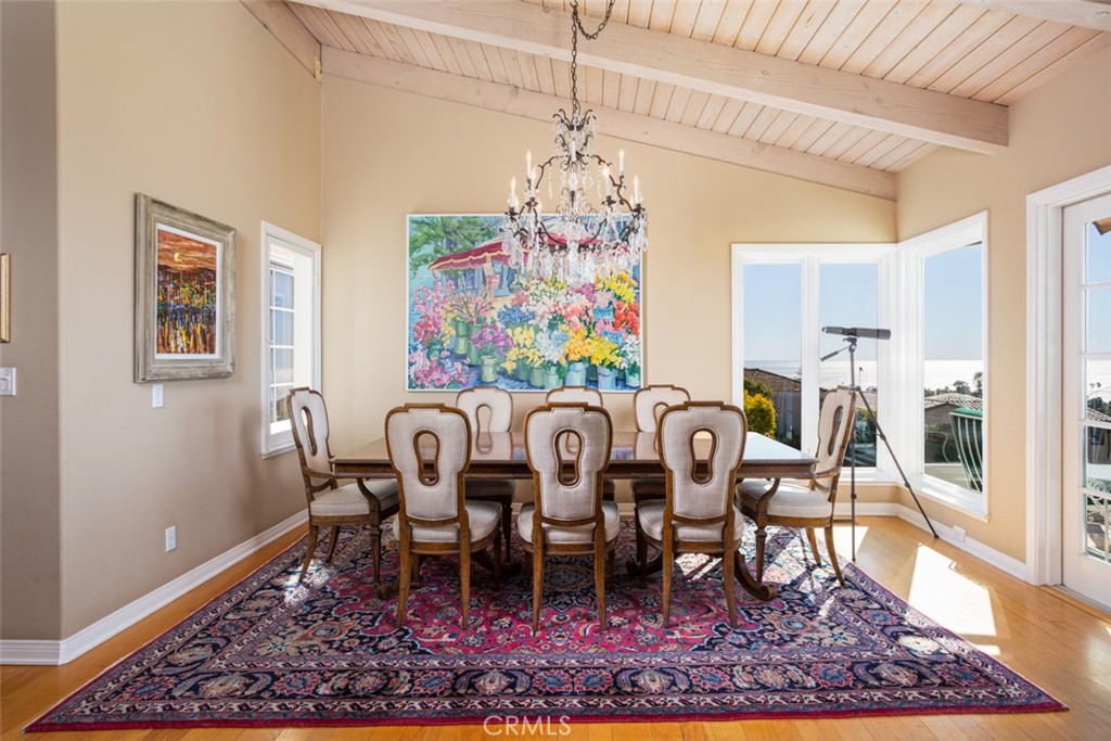521 Emerald Bay Laguna Beach, CA 92651 - Photo 17 of 42 a view of a dining room with furniture wooden floor and rug