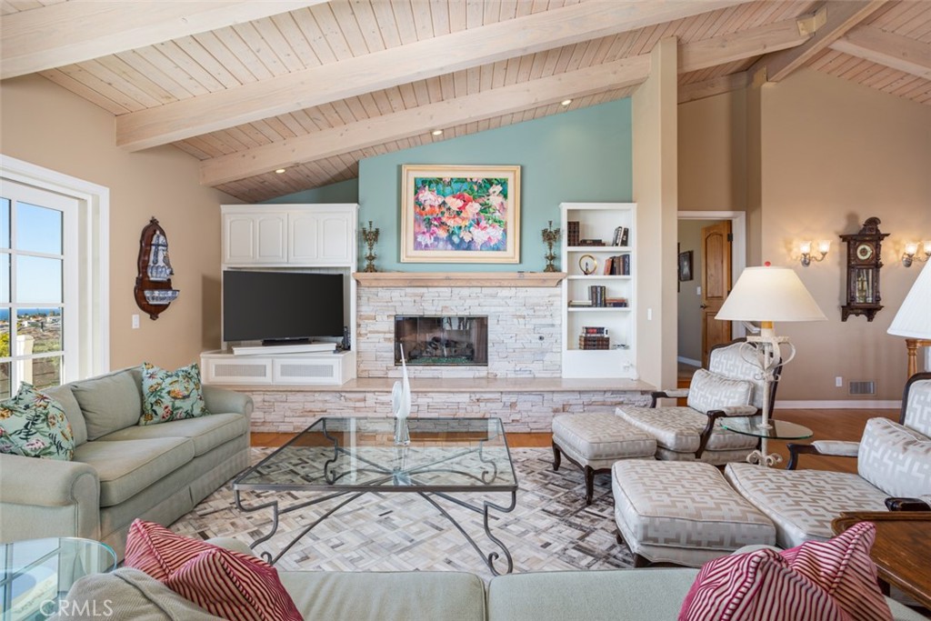 521 Emerald Bay Laguna Beach, CA 92651 - Photo 19 of 42 a living room with furniture and a flat screen tv