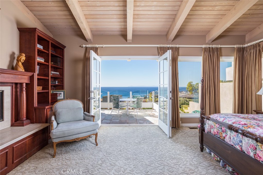 521 Emerald Bay Laguna Beach, CA 92651 - Photo 25 of 42 a living room with furniture and a floor to ceiling window