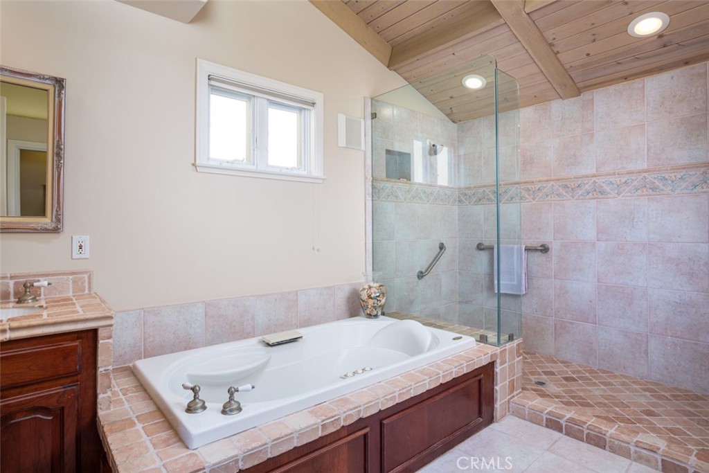 521 Emerald Bay Laguna Beach, CA 92651 - Photo 27 of 42 a bathroom with a tub a sink and a shower