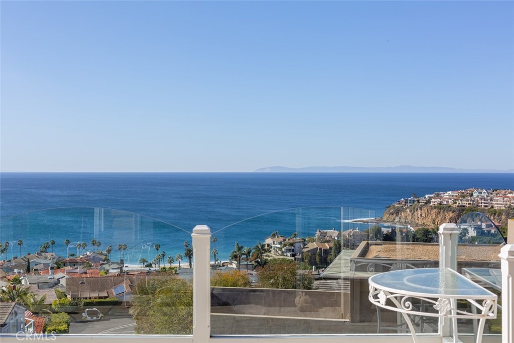 521 Emerald Bay Laguna Beach, CA 92651 - Photo 3 of 42 a view of roof deck with dining table and chairs