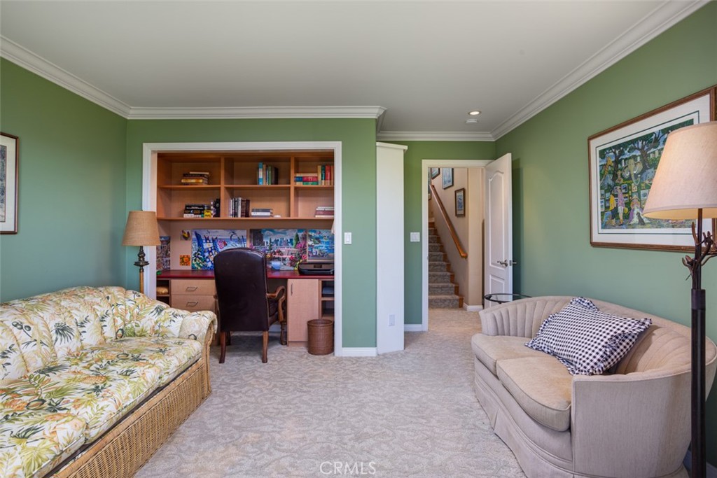 521 Emerald Bay Laguna Beach, CA 92651 - Photo 32 of 42 a bedroom with a bed and a couch