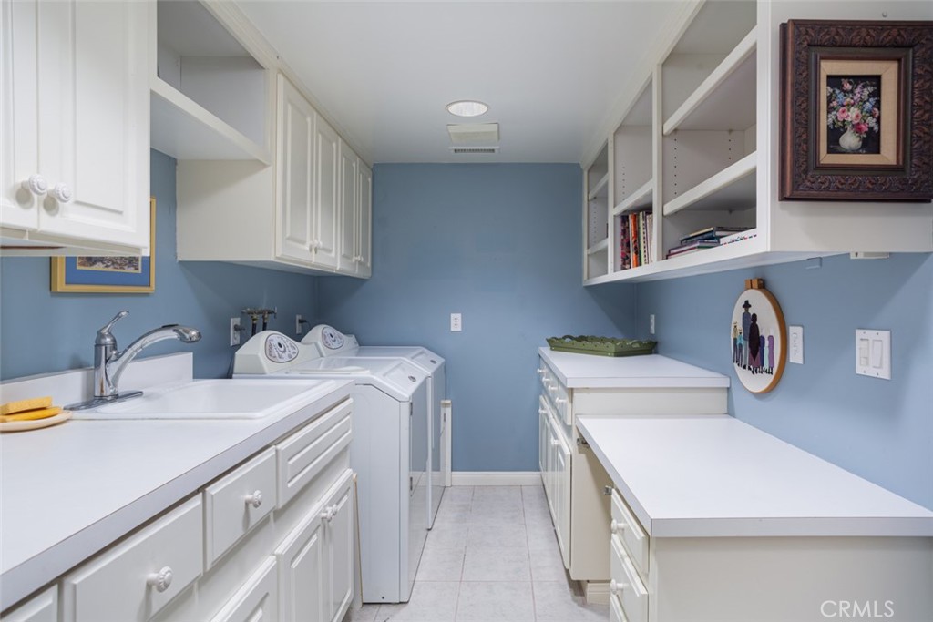 521 Emerald Bay Laguna Beach, CA 92651 - Photo 36 of 42 a kitchen with a sink stove and cabinets