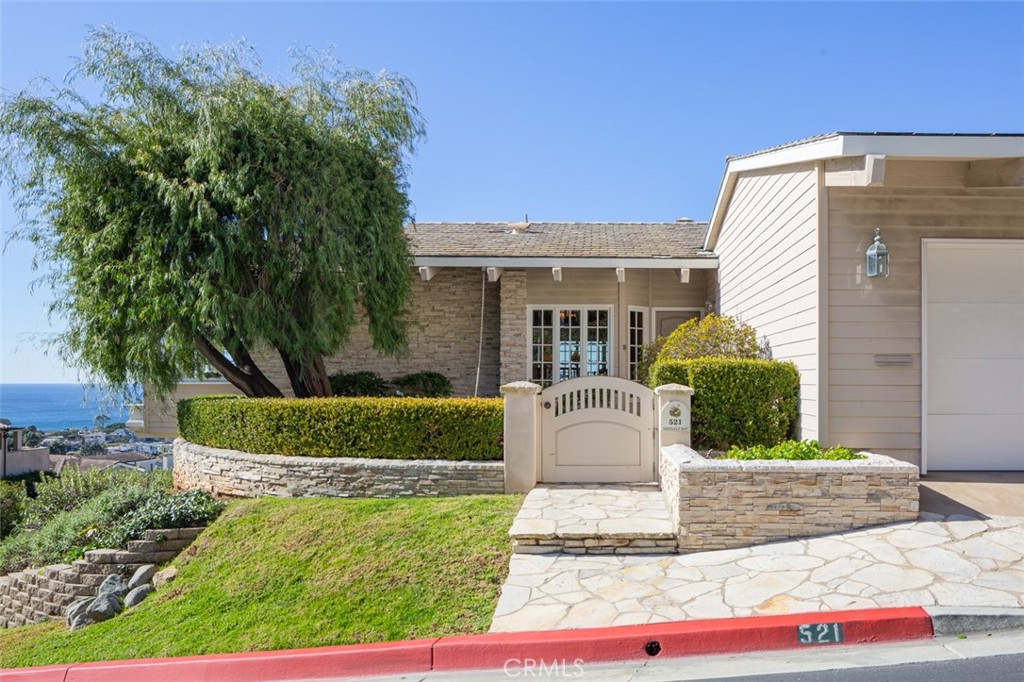 521 Emerald Bay Laguna Beach, CA 92651 - Photo 5 of 42 a front view of a house with a yard