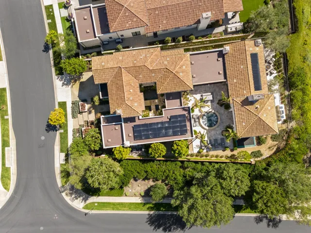 an aerial view of a house with a swimming pool